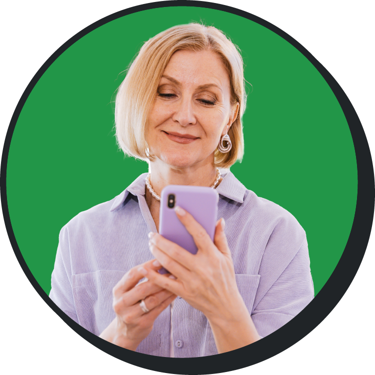 women in green with purple phone